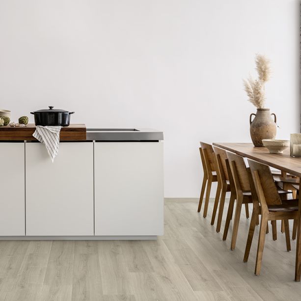 white kitchen with a grey oak laminate floor